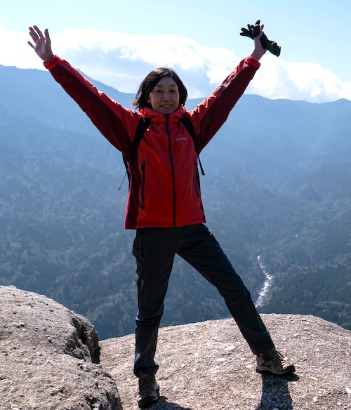 photo of therapist on top of a mountain